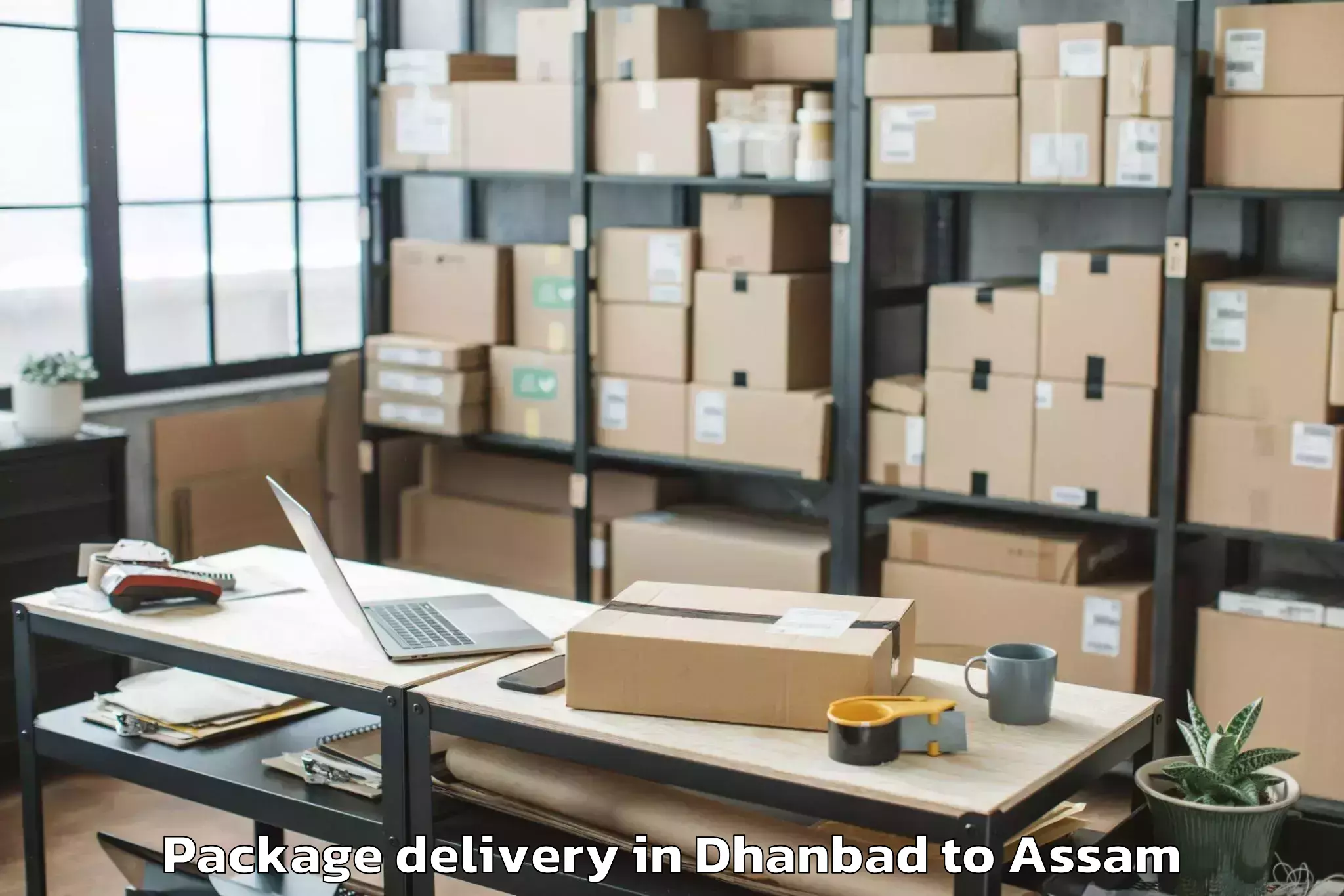 Trusted Dhanbad to Kharupatia Package Delivery